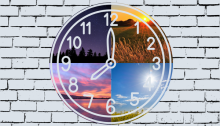 A clock on a brick wall. The clock is divided into four quarters that contain pictures of the sky at different times of day.